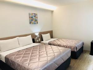 Postel nebo postele na pokoji v ubytování Chance Hotel