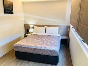 Postel nebo postele na pokoji v ubytování Chance Hotel
