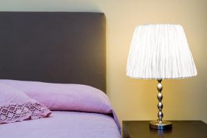 A bed or beds in a room at Diamond Apartment