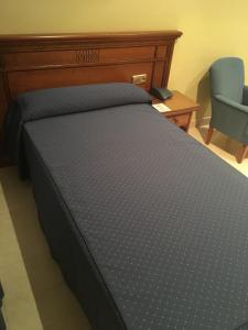 Łóżko lub łóżka w pokoju w obiekcie Hotel Manolo Mayo