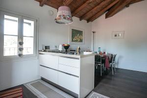 a kitchen with a counter and a table in it at Villa Casetti B&B in Fontanelice