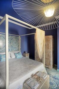 Tempat tidur dalam kamar di Donna Filomena Casa Vacanza di Charme