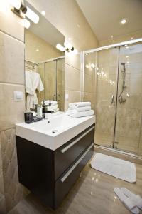 a bathroom with a sink and a shower at Boutique Hotel Leningrad in Saint Petersburg