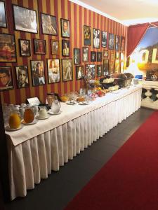 a buffet line with a long table with food on it at Film Hotel in Bratislava