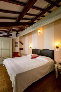 Ένα ή περισσότερα κρεβάτια σε δωμάτιο στο Agriturismo Corte Carezzabella