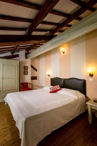 Katil atau katil-katil dalam bilik di Agriturismo Corte Carezzabella