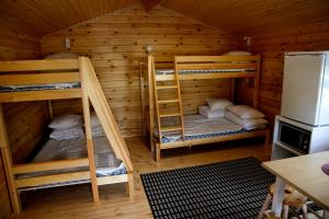 a room with two bunk beds in a cabin at Seinäjoen leirintäalue in Seinäjoki