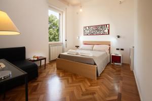 Ліжко або ліжка в номері Room In Roma Isole