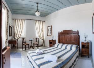Posteľ alebo postele v izbe v ubytovaní Nostos Guesthouse