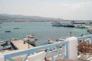 a group of boats are docked in a harbor at Hotel Mantalena in Antiparos Town