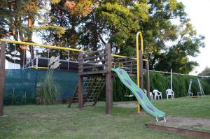 a playground with a slide and a slide at Solares Hotel & Spa in Alta Gracia