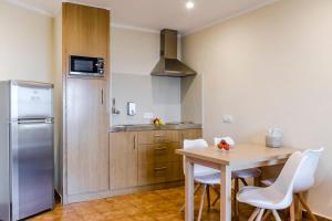 Η κουζίνα ή μικρή κουζίνα στο Apartamentos Blancala