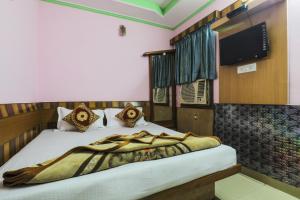 Ein Bett oder Betten in einem Zimmer der Unterkunft Hotel Sweet Home DX