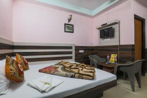 Ein Bett oder Betten in einem Zimmer der Unterkunft Hotel Sweet Home DX