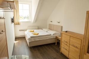 Postel nebo postele na pokoji v ubytování Pivovarský dvůr Zvíkov + 29 fotografií