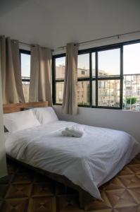 Postel nebo postele na pokoji v ubytování Hostel BU93