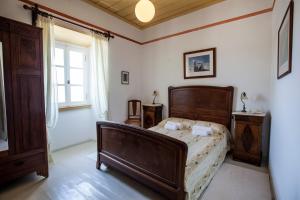 Posteľ alebo postele v izbe v ubytovaní Nostos Guesthouse