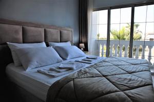 Postel nebo postele na pokoji v ubytování Hotel Veliera