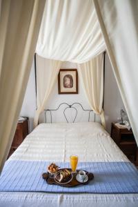 Posteľ alebo postele v izbe v ubytovaní Nostos Guesthouse