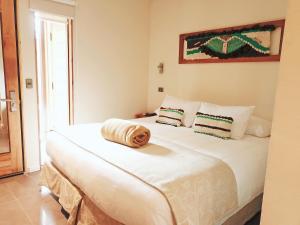 Postel nebo postele na pokoji v ubytování Maki Hotel