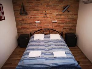 Postel nebo postele na pokoji v ubytování Ráday Apartman