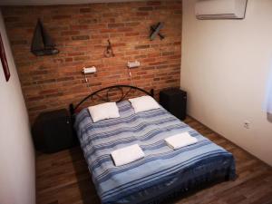 Postel nebo postele na pokoji v ubytování Ráday Apartman