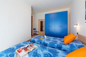 Posteľ alebo postele v izbe v ubytovaní La Mimosa B03 Apartment by Wonderful Italy