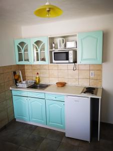 Kuchyň nebo kuchyňský kout v ubytování Ráday Apartman