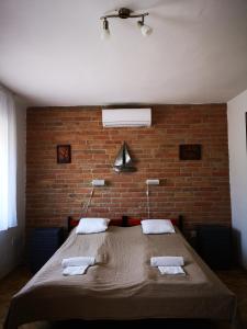 Postel nebo postele na pokoji v ubytování Ráday Apartman + 33 fotografií