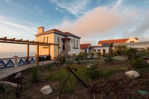 a house with a view of the ocean at Chalet O Amorzinho Sintra Praia in Sintra