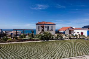 a villa with a view of the ocean at Chalet O Amorzinho Sintra Praia in Sintra