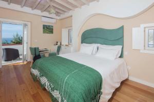 Postel nebo postele na pokoji v ubytování Chalet O Amorzinho Sintra Praia