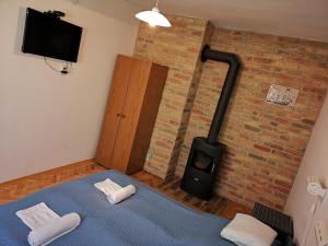 Postel nebo postele na pokoji v ubytování Ráday Apartman