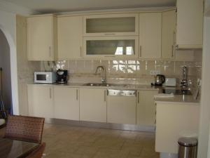 A kitchen or kitchenette at Beach Apt. 0