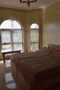 Letto o letti in una camera di Guest house BAGRATIONI