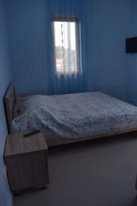 Letto o letti in una camera di Guest house BAGRATIONI