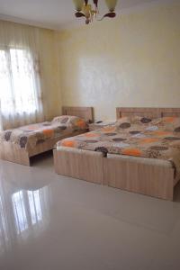 Postel nebo postele na pokoji v ubytování Guest house BAGRATIONI