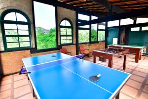 a large room with a ping pong table in it at Pousada Tanto Mar in Arraial do Cabo