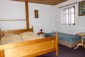 Postel nebo postele na pokoji v ubytování Horský Ranč