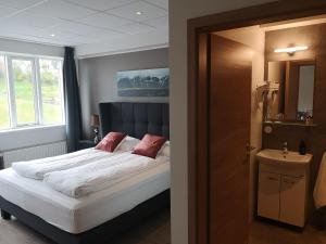 Postel nebo postele na pokoji v ubytování Centrum Hotel