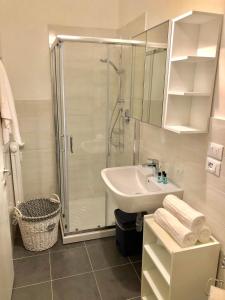 a bathroom with a shower and a sink at CITYHOUSE in Padova