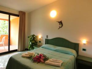 Postel nebo postele na pokoji v ubytování Hotel Blu Marlin