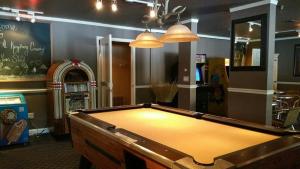 a pool table in a room with a restaurant at Lodge at Kingsbury Crossing in Stateline