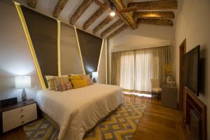 Ένα ή περισσότερα κρεβάτια σε δωμάτιο στο Visus Hotel Boutique & Spa
