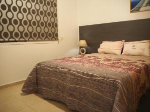 מיטה או מיטות בחדר ב-Sirena Sunrise Prestige apartments