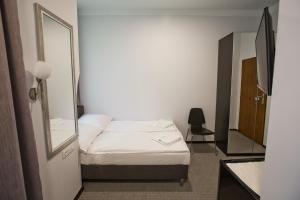 Posteľ alebo postele v izbe v ubytovaní R&B APARTMENTS POZNAŃ
