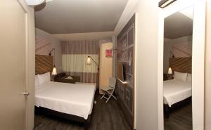 Cama ou camas em um quarto em ibis Natal