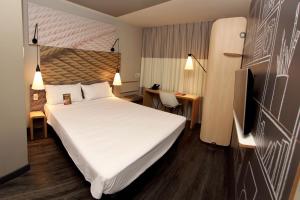 Cama ou camas em um quarto em ibis Natal