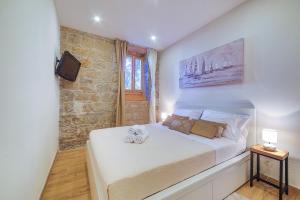 Posteľ alebo postele v izbe v ubytovaní Bacvice apartment Slavija