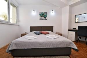 Posteľ alebo postele v izbe v ubytovaní Fran Green & Blue apartment